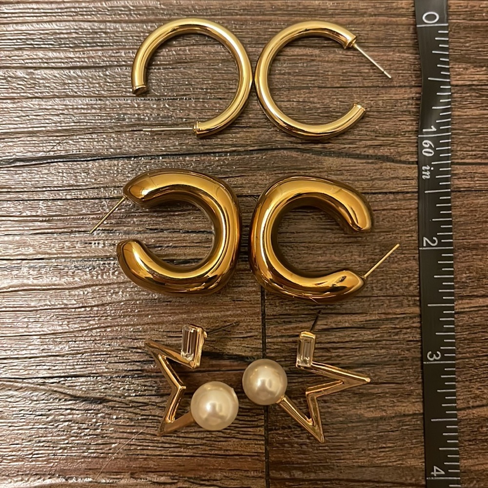 Four pairs of gold plated earrings